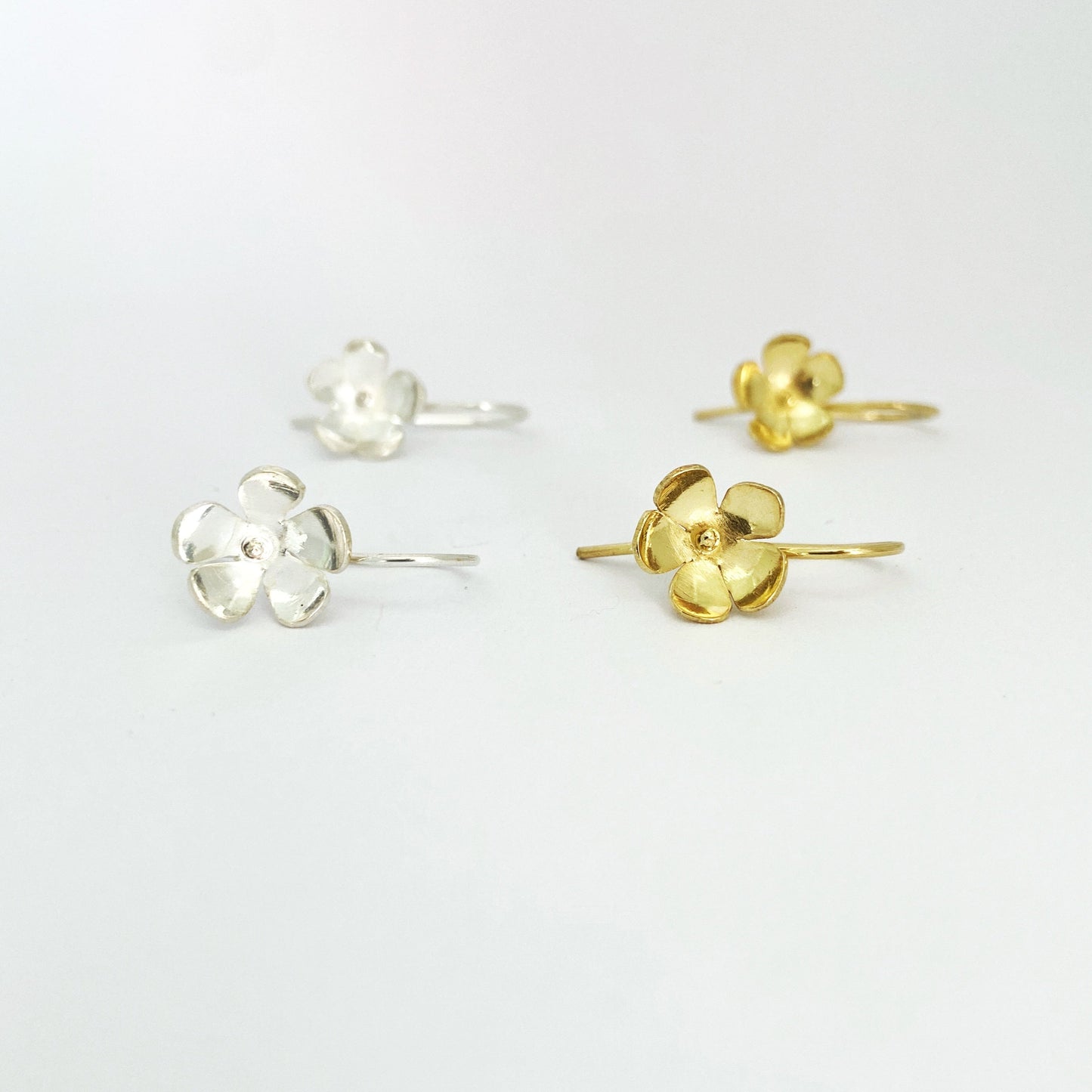 Five petal flower drop in silver and gold by South African designer Savage Jewellery