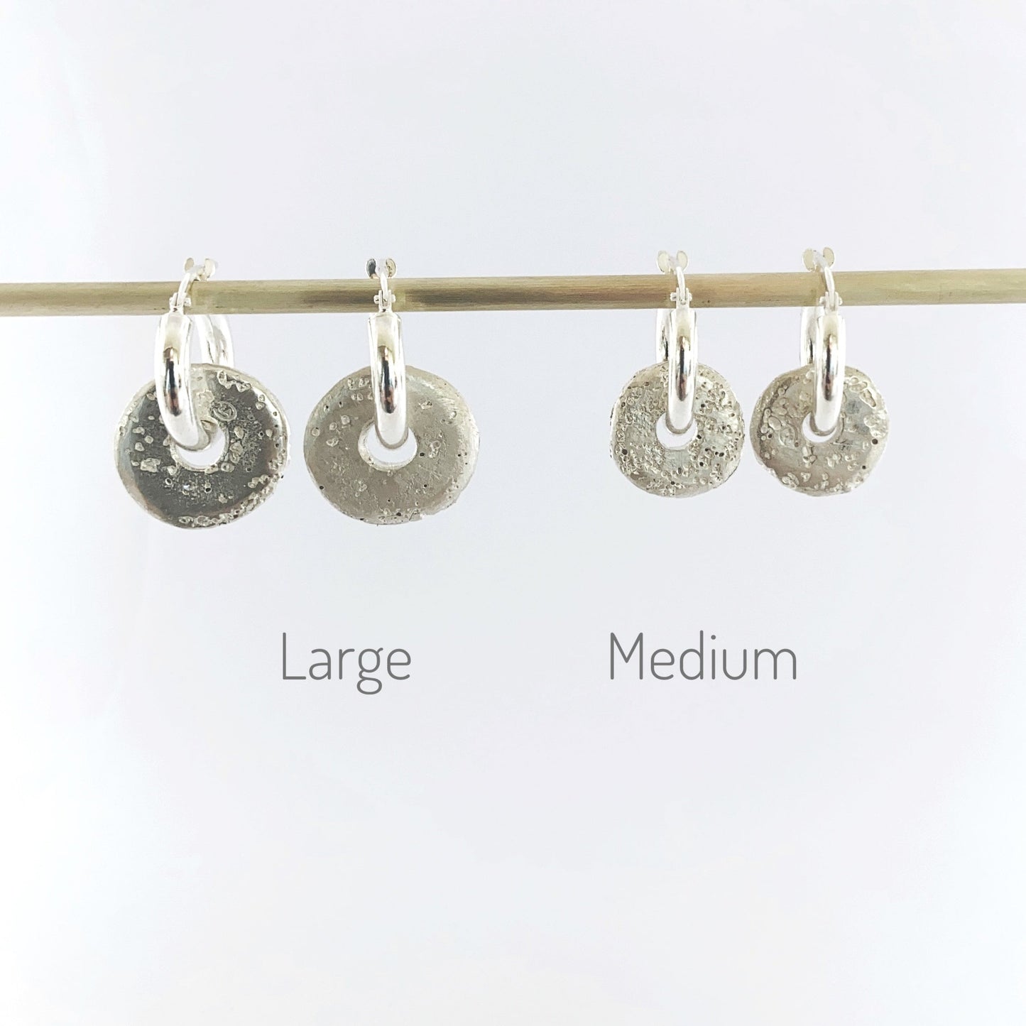 Large and medium sand cast donuts on hoops by Durban designer Savage Jewellery