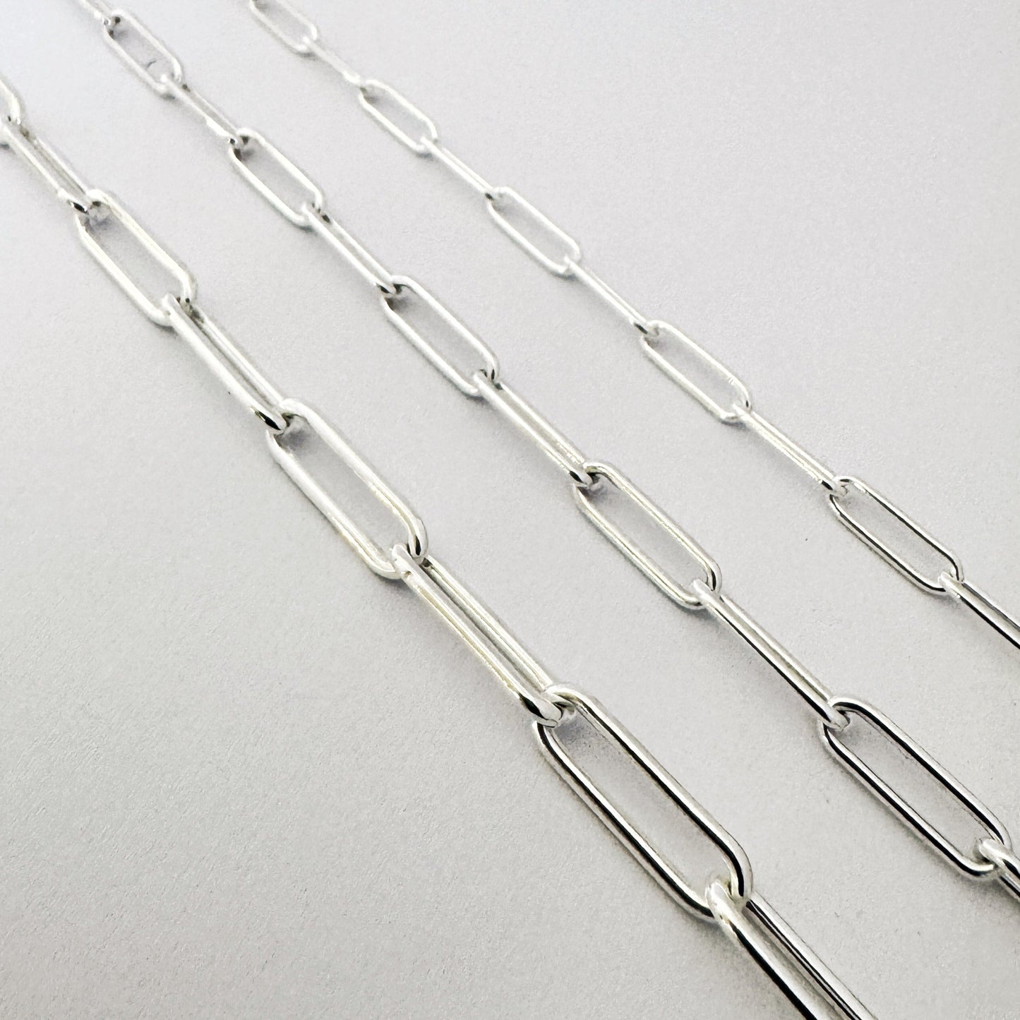 silver paperclip necklace in three different link sizes by Savage Jewellery