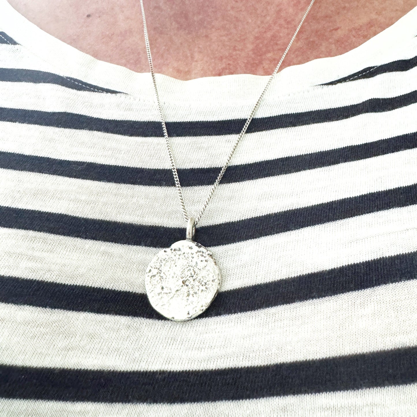 handmade sterling silver textured sand cast disk pendant by Savage Jewellery