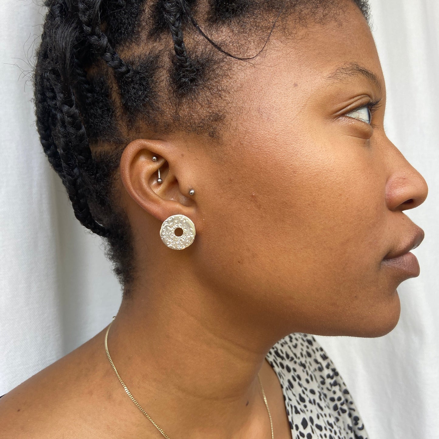 contemporary earrings - Large button stud with sand cast texture by South African jeweller Savage Jewellery.