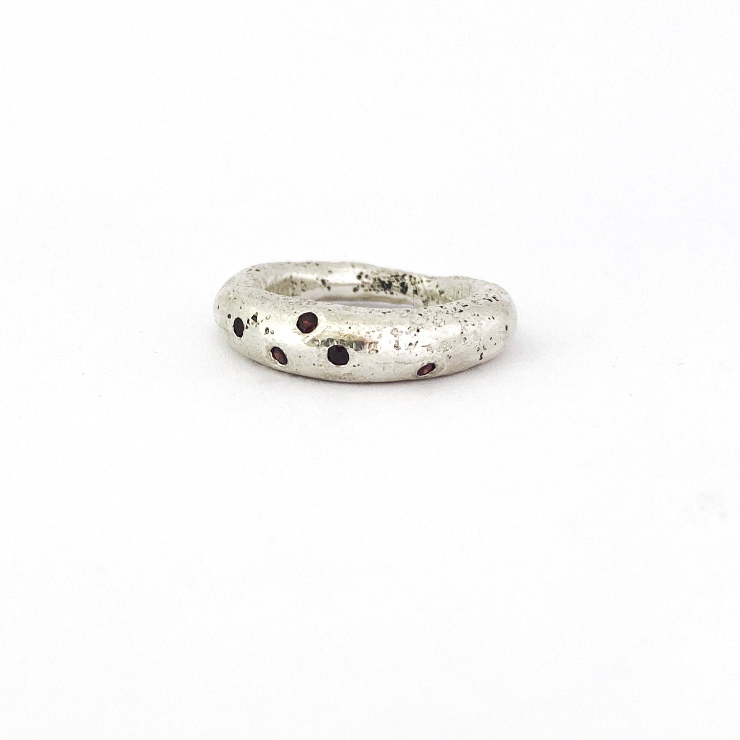 chunky tapered sand cast ring with garnets by designer Savage Jewellery