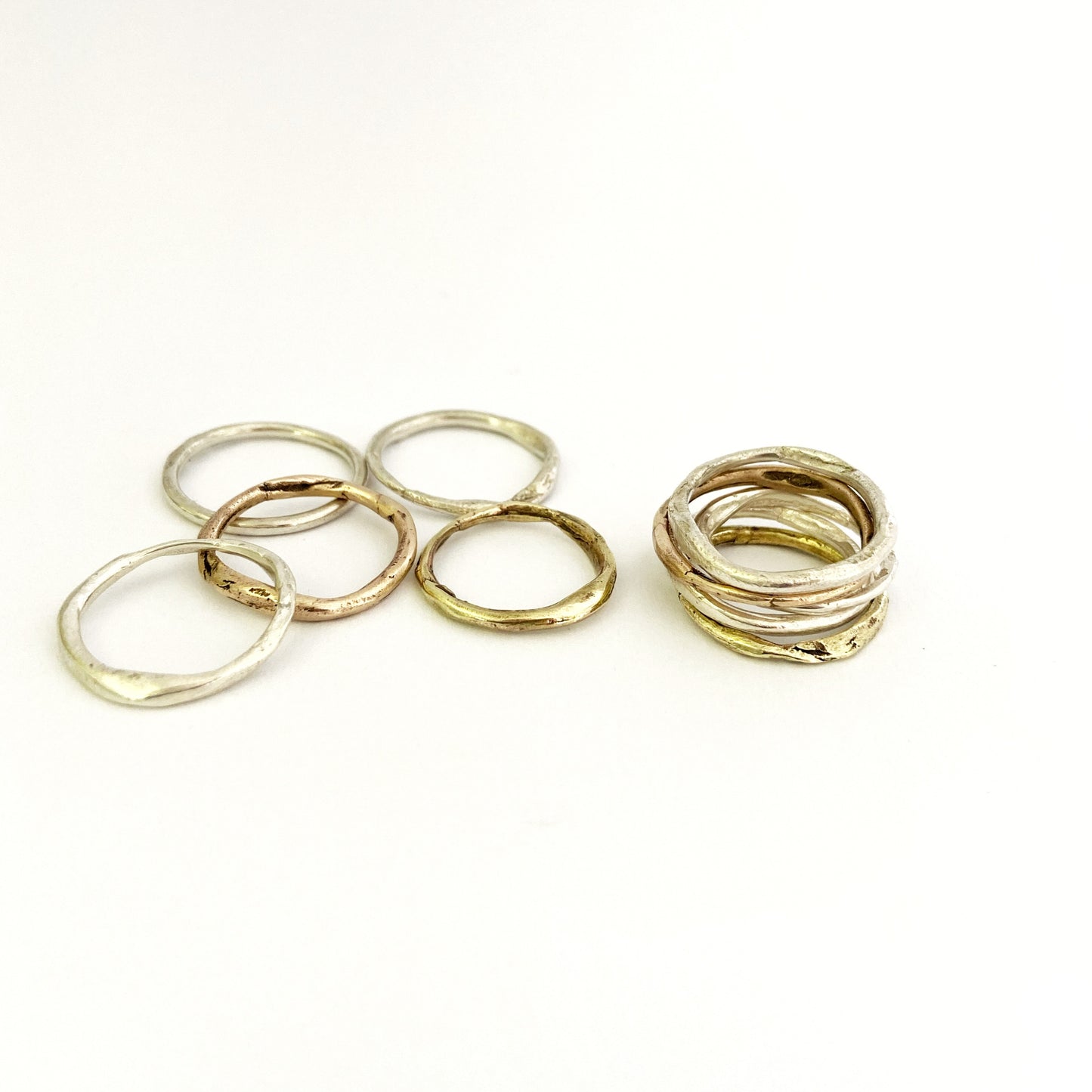 Organic stacking rings in sliver, brass and bronze by Savage Jewellery, South Africa