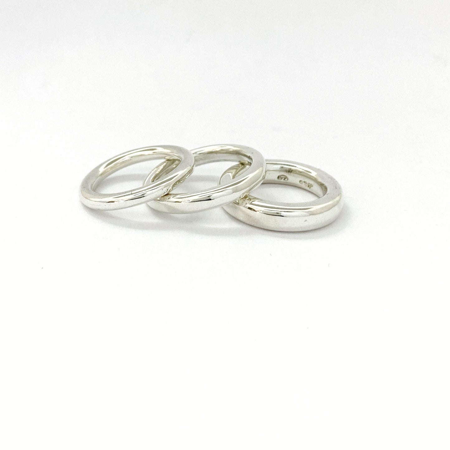Simple solid silver stacking rings in 3mm, 4mm and 5mm widths, by Savage Jewllery