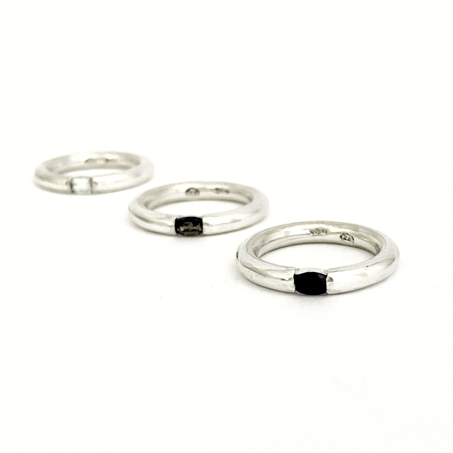 Designer gemstone ring stack with black, brown and white gemstones by Savage Jewellery