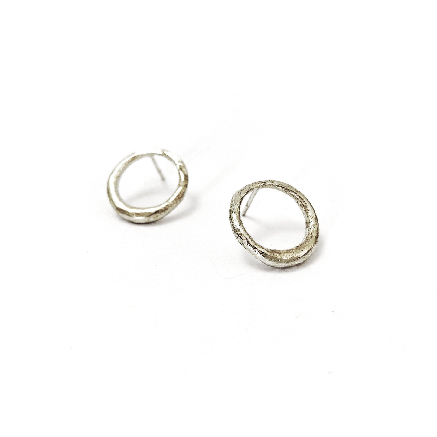 silver circle stud earrings with organic texture by designer Savage Jewellery