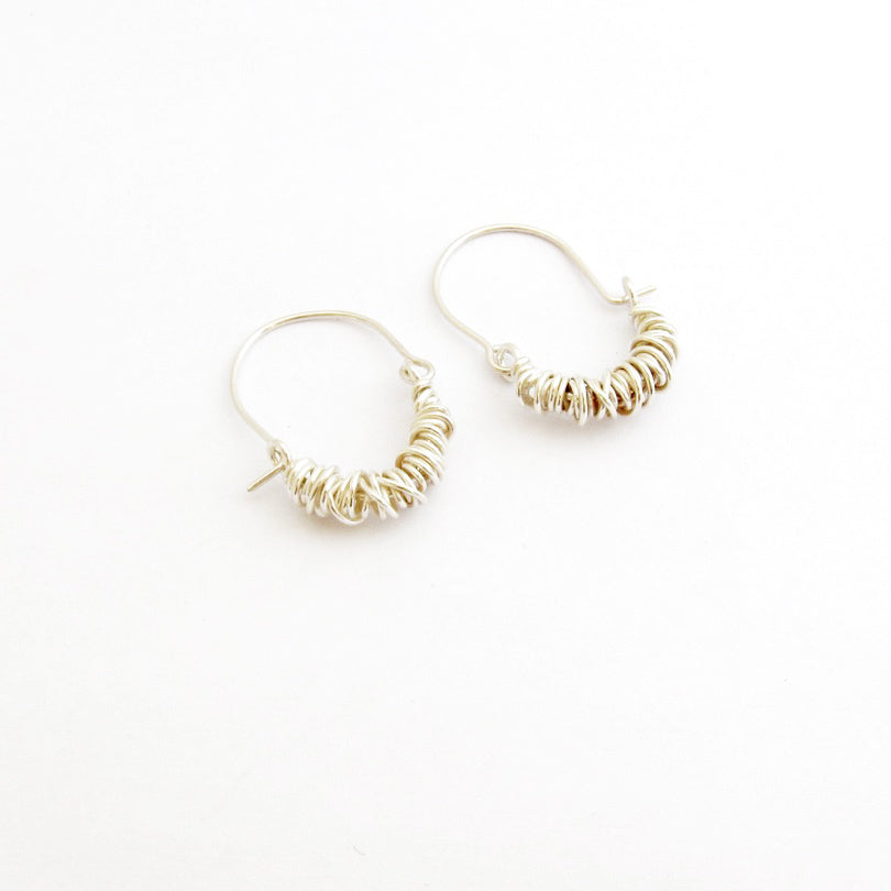 Wrapped wire hoop style earrings by designer Savage Jewellery