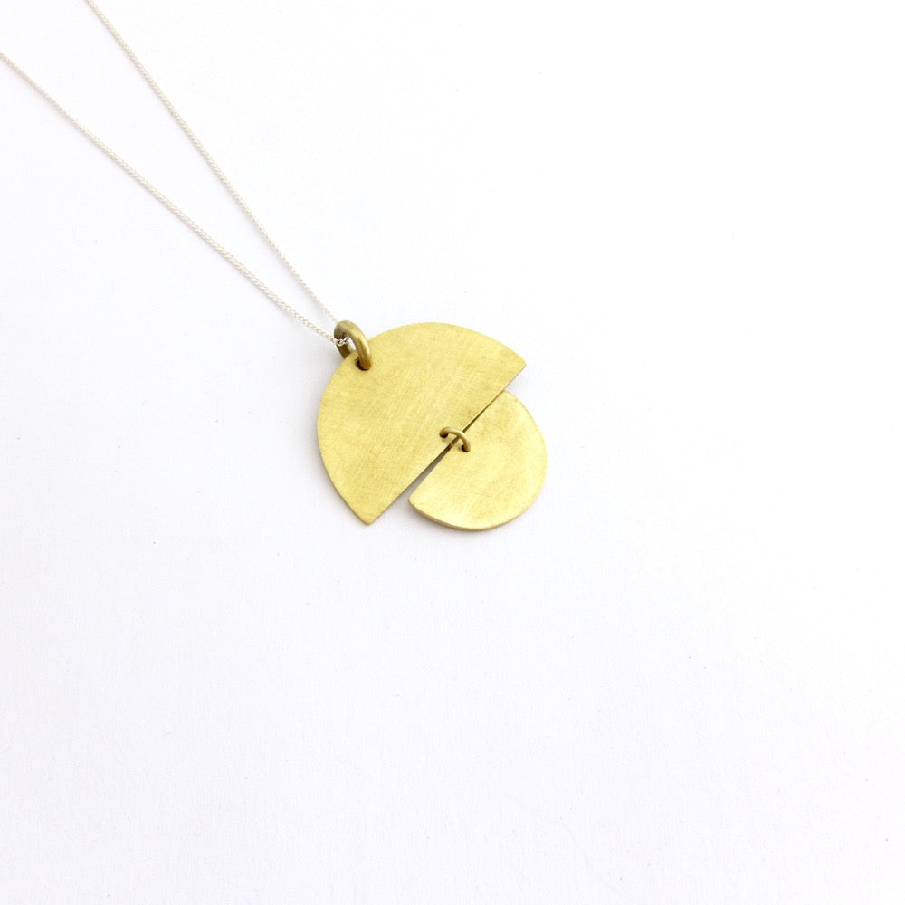 brass sunrise pendant on silver chain by savage jewellery