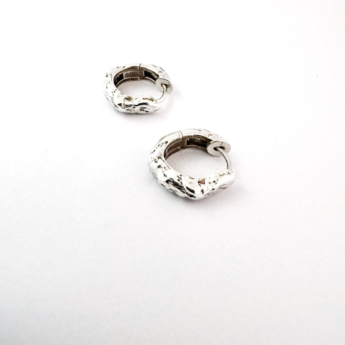 Sterling silver huggies with an organic texture