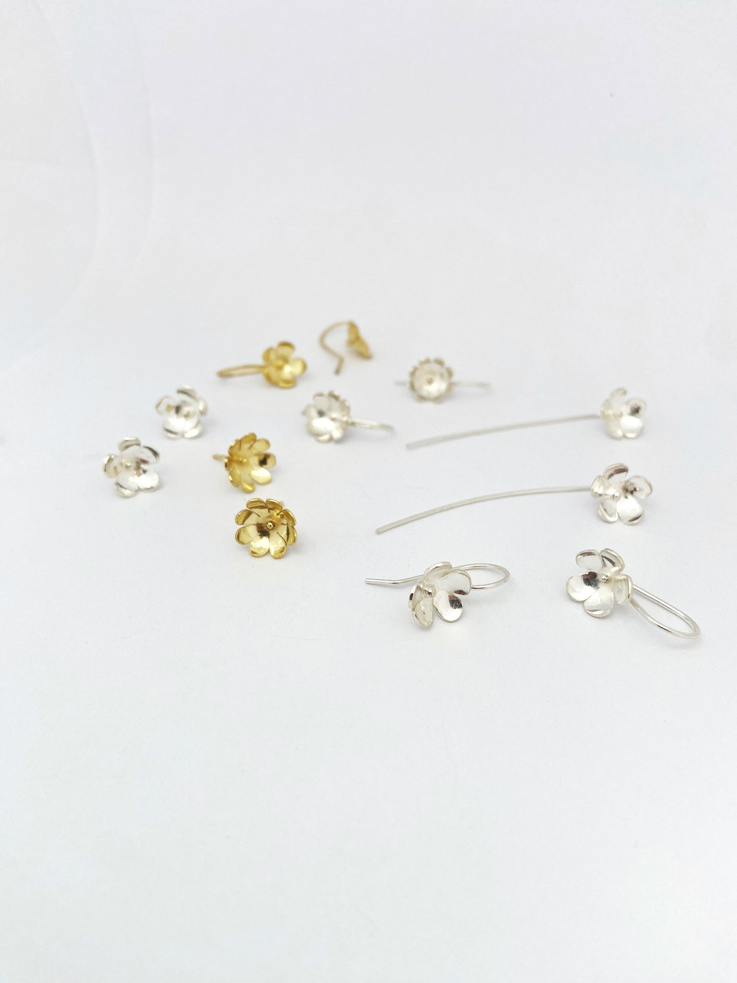 Flower earrings in silver and gold. Perfect for any occasion by Savage Jewellery