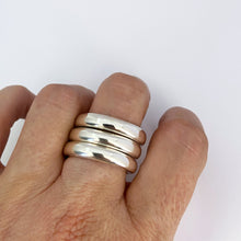 Three silver stacking rings by contemporary jeweller Savage Jewellery