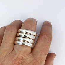Four chunky staking rings worn together to make a statement by Savage Jewelllery