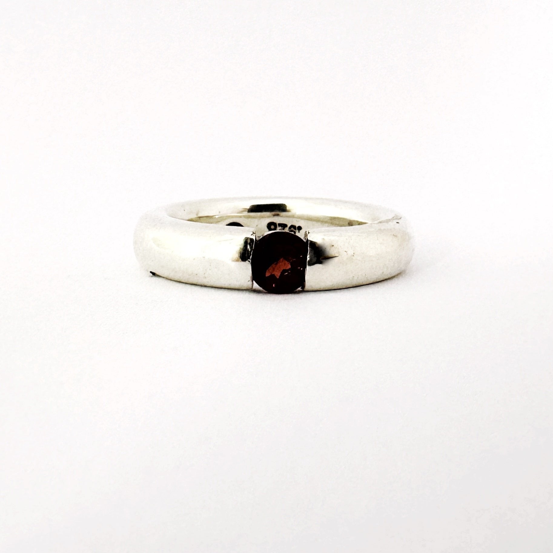 Minimalist silver ring with 5mm round garnet stone by Savage Jewellery