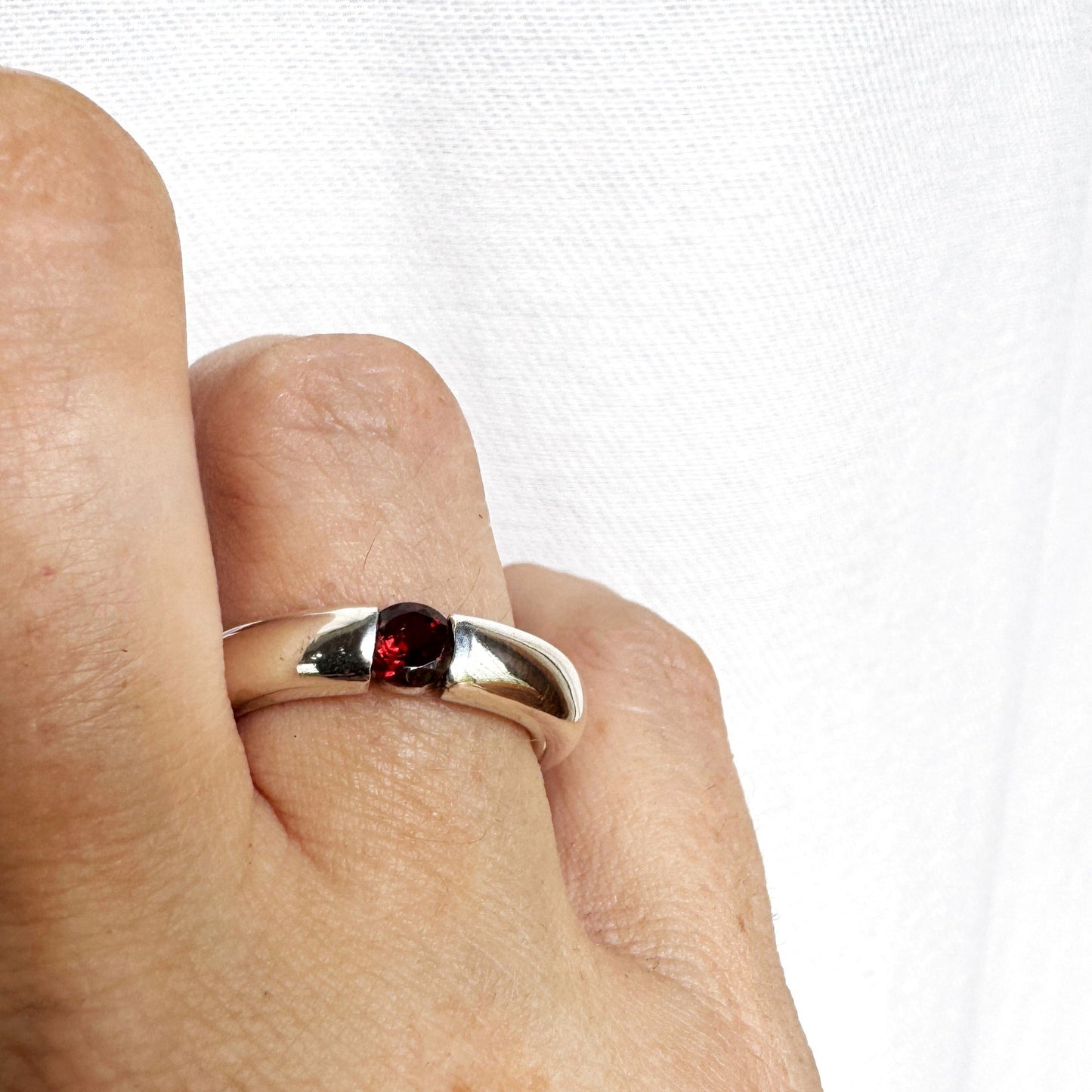 Simple sterling silver ring with 5mm round garnet stone