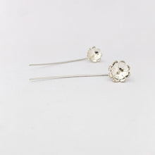 Silver daisy on a stick earring by contemporary jeweller Savage Jewellery