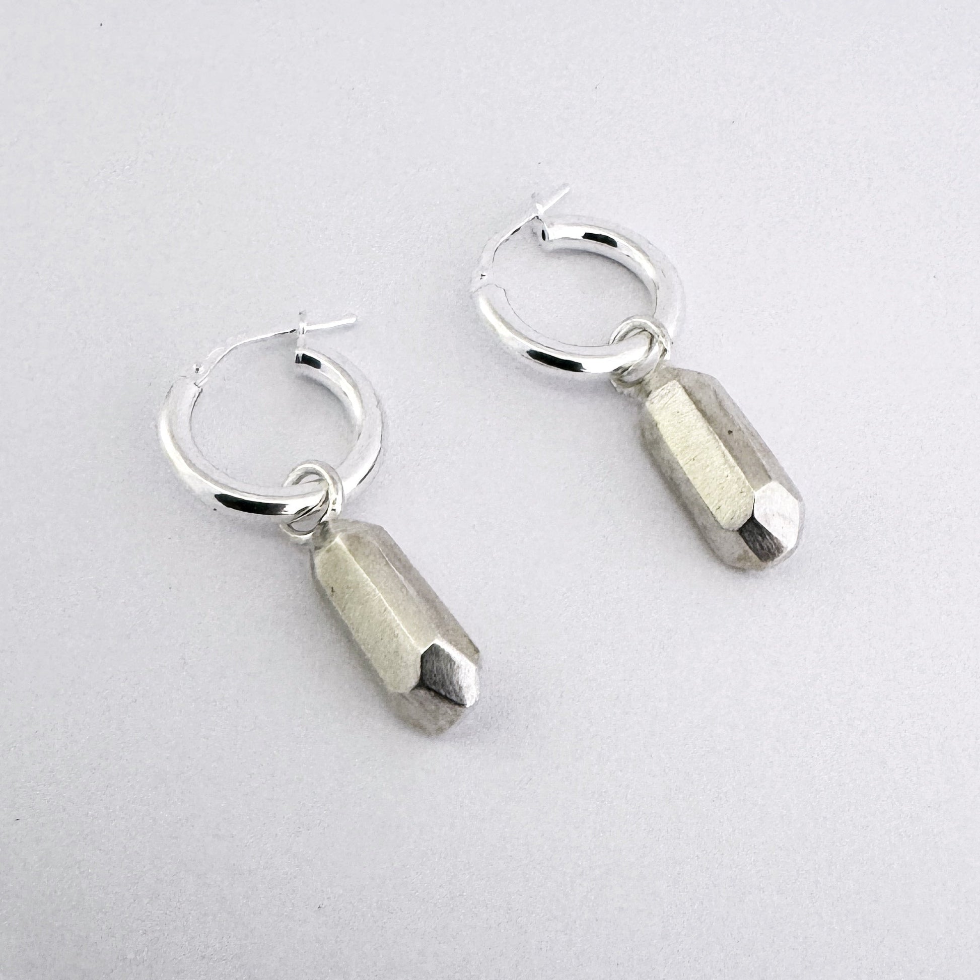 Hoop earrings with charm element in a emerald cut nugget charm in sterling silver by Savage Jewellery