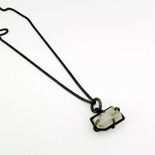Contemporary quartz crystal necklace with oxidised sterling silver by Savage Jewellery