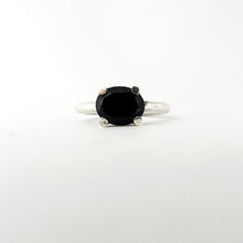 Modern silver ring with four chunky claws holding an oval black spinel by Savage Jewelry