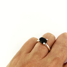 contemporary Four claw silver ring with an oval black spinel by designer Savage Jewellery
