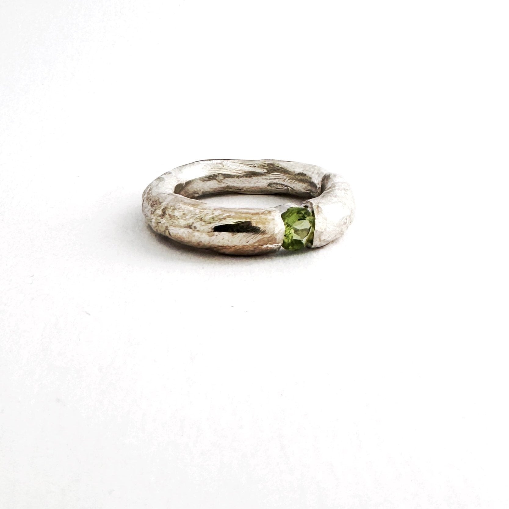 Textured organic ring in sterling silver with round peridot