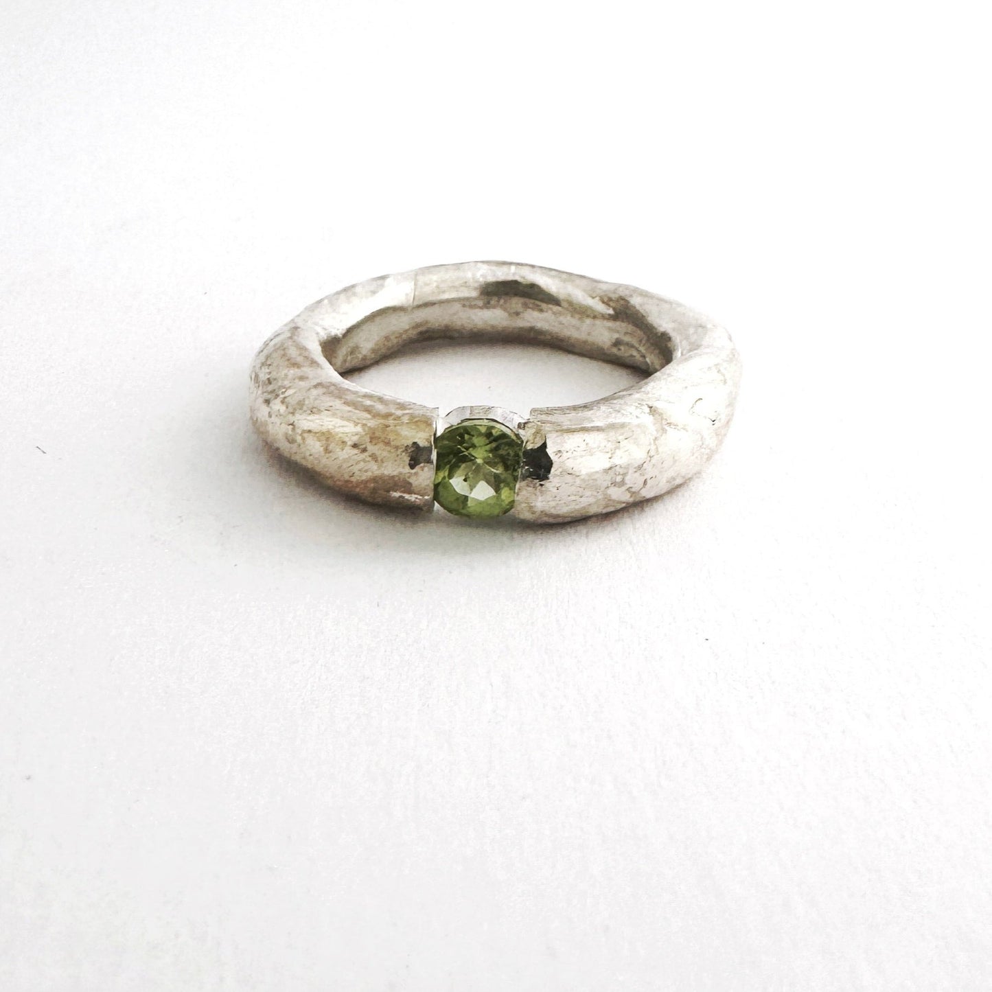 textured 5mm organic ring with a round peridot by Savage Jewellery