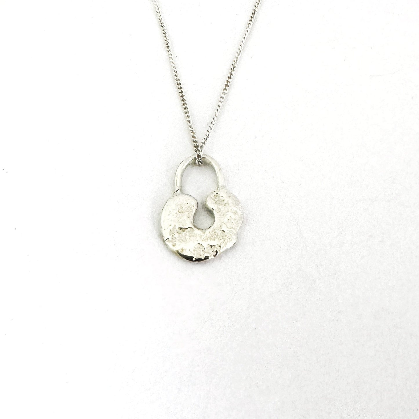 Lock pendant - uniquely different silver sandcast lock pendant on chain by Savage Jewellery