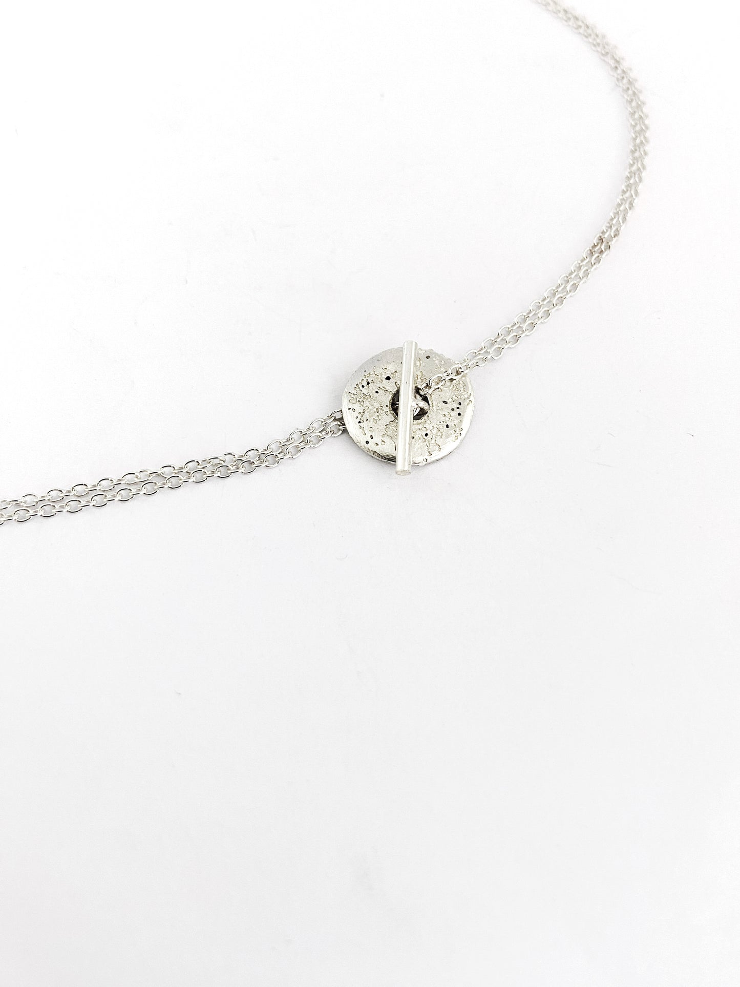 Fob style necklace with Large sandcast donut in silver or bronze