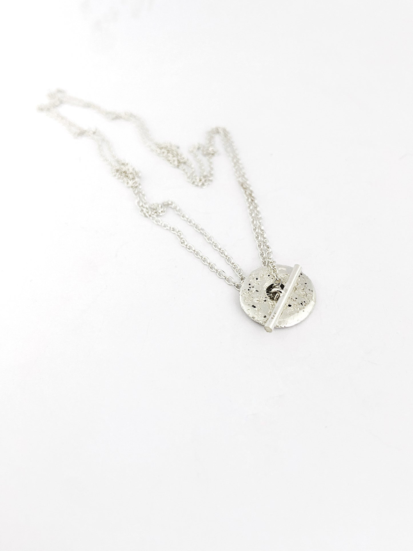 Fob style necklace with Large sandcast donut in silver or bronze