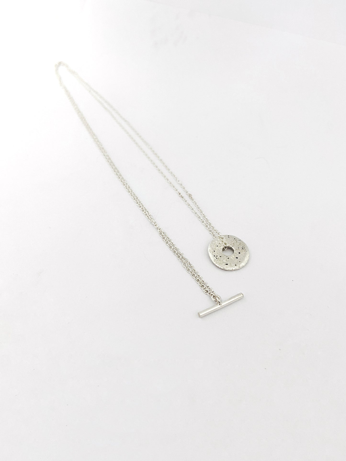 Fob style necklace with Large sandcast donut in silver or bronze