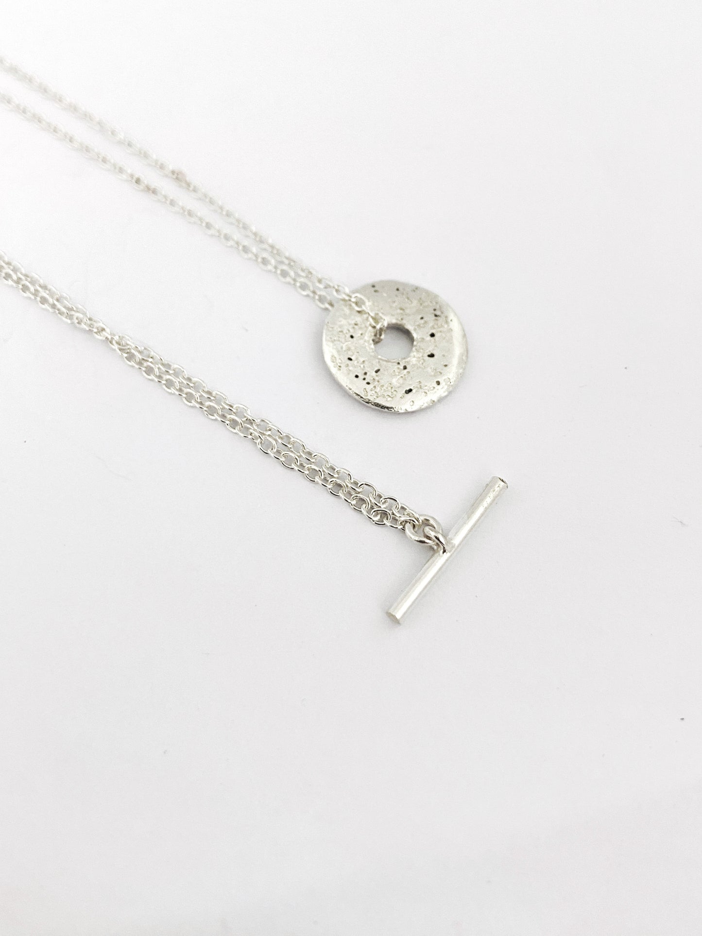 Fob style necklace with Large sandcast donut in silver or bronze