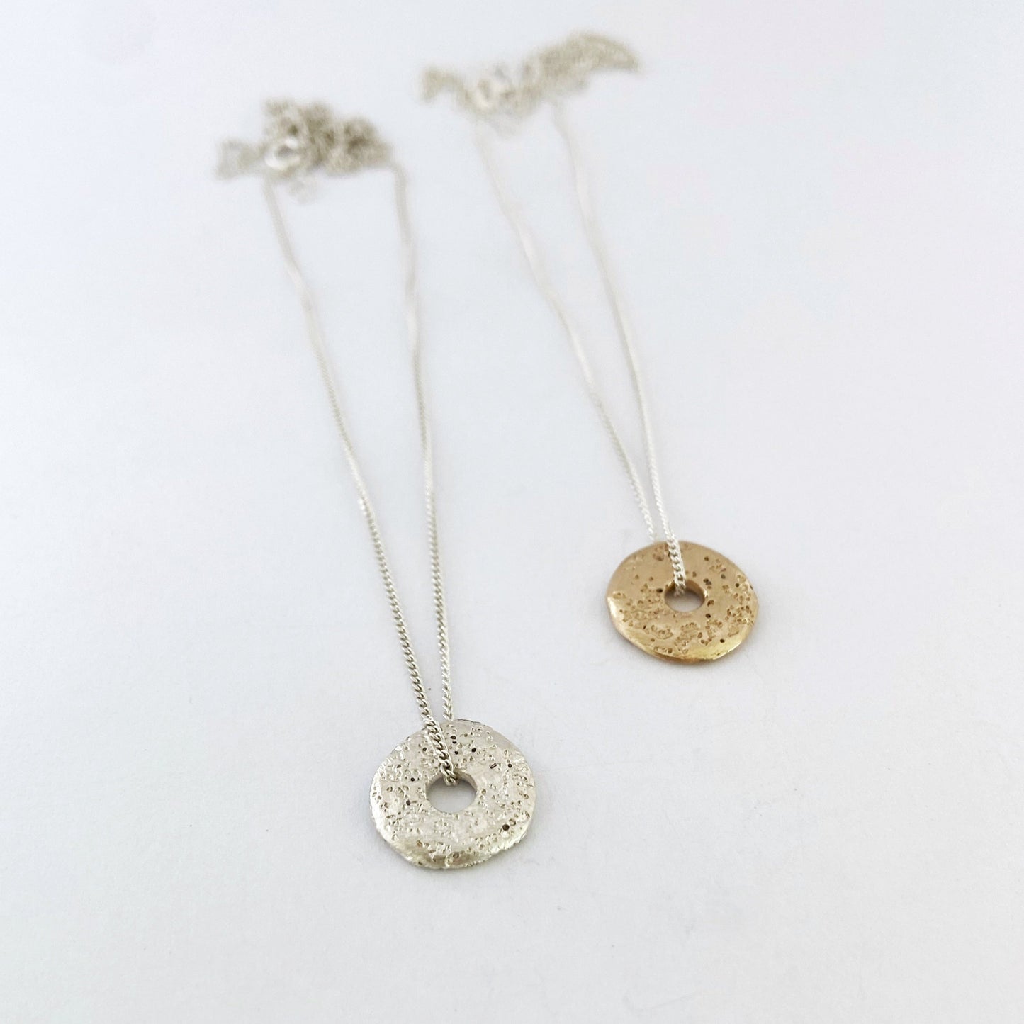 Medium sand cast donut necklace in gold and silver by Savage Jewellery