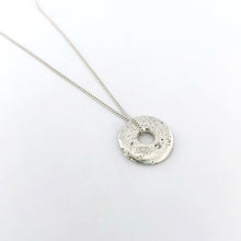 Large sand cast donut pendant with lab grown diamond by designer Savage Jewellery