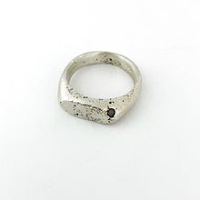 textured silver signet ring with salt and pepper diamond