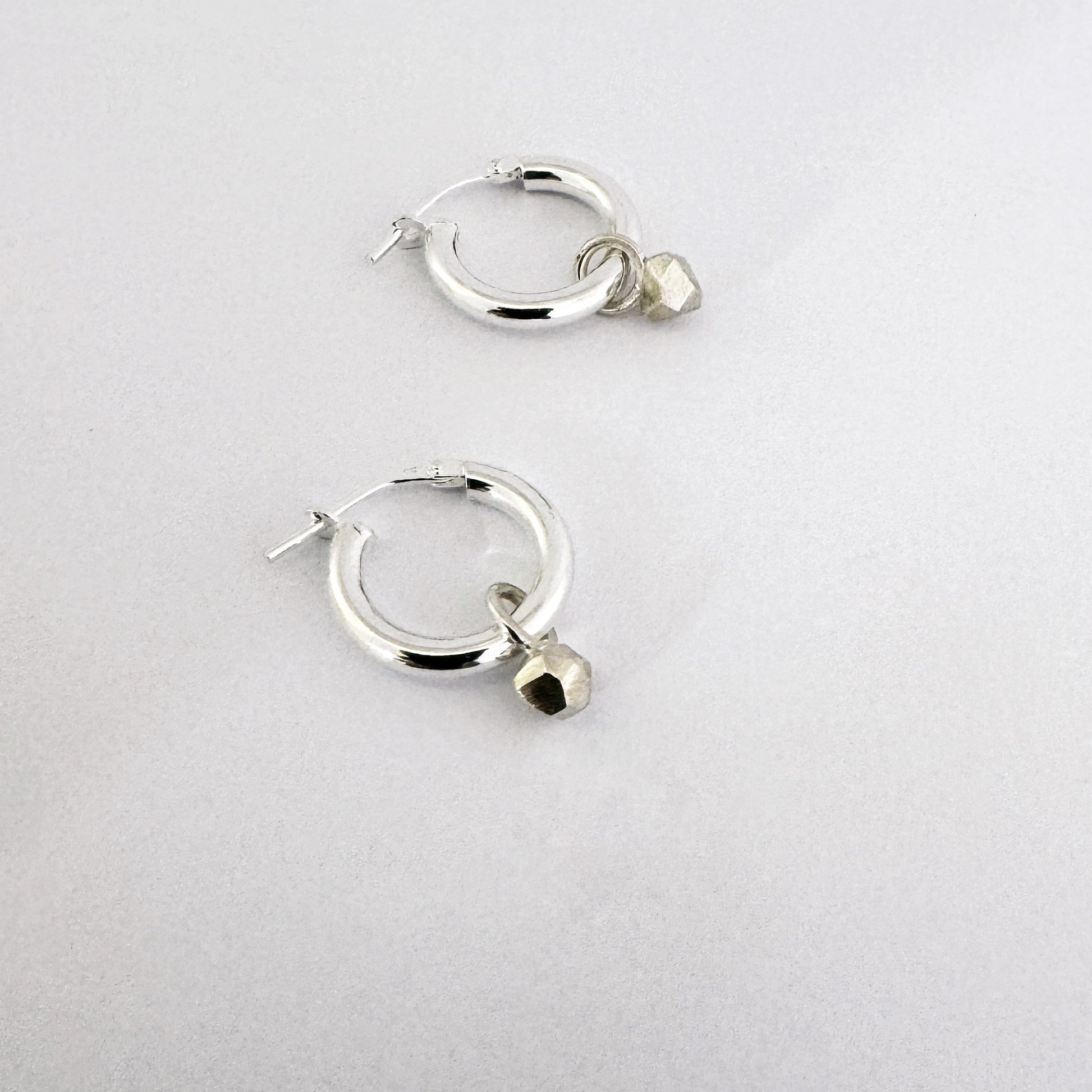 silver hoop earrings with tiny nugget charm - modern earrings for everyday wear by Savage Jewellery