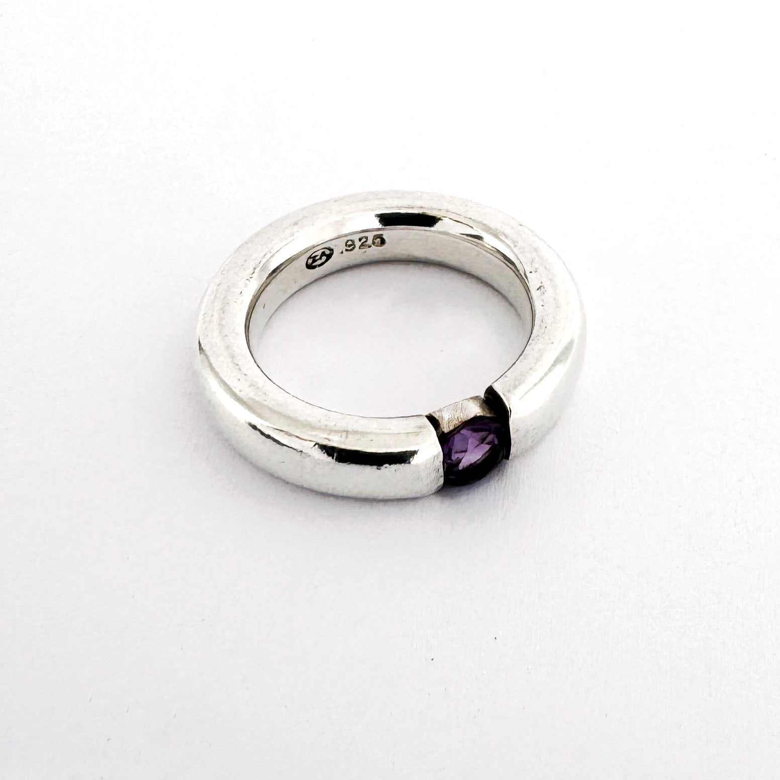 minimalist silver ring with round amethyst in a floating like setting