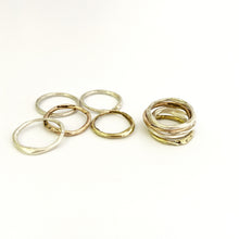 Organic stacking rings in sliver, brass and bronze by Savage Jewellery, South Africa