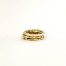 Silver, brass and bronze organic stacking rings by Savage Jewellery