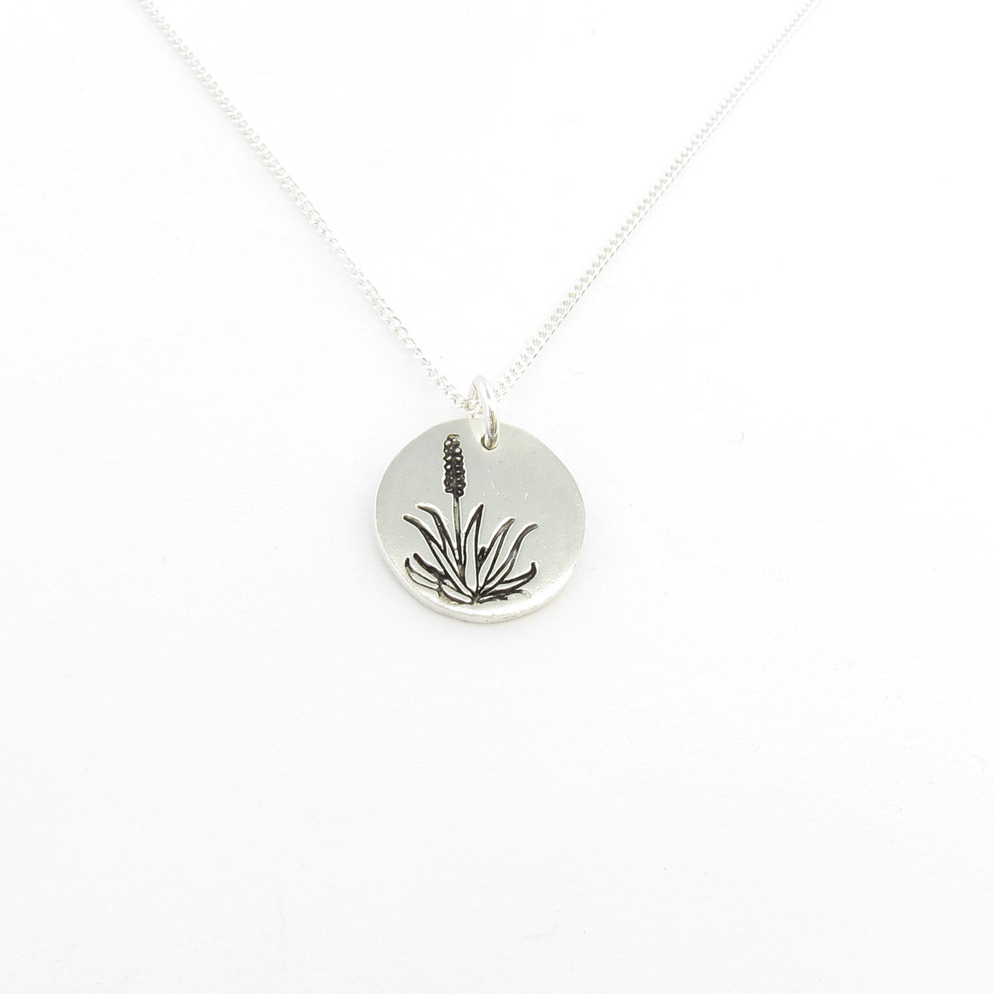 Aloe disk on chain this is part of the Icon Africa range designed in Durban South Africa by Savage Jewellery