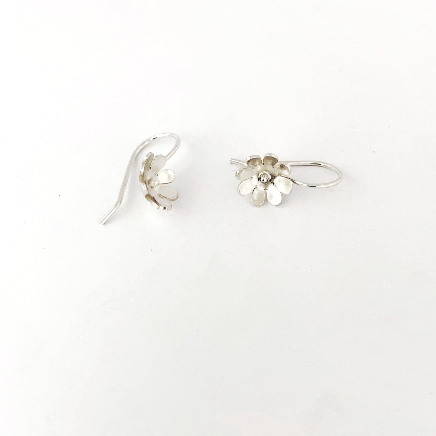 Silver daisy earring with hook by Savage Jewellery