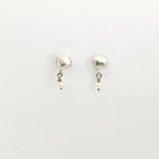 Nugget studs in silver with pearl bead dangling off by Savage Jewellery