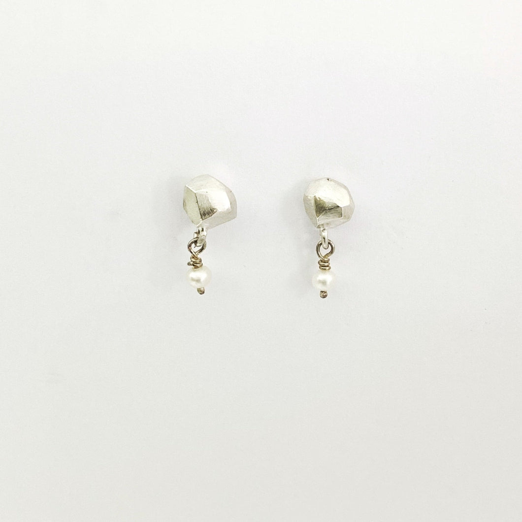 Nugget studs in silver with pearl bead dangling off by Savage Jewellery