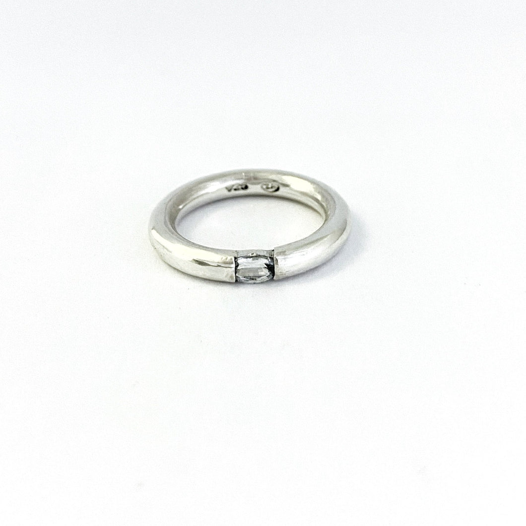 white sapphire floating in 3mm round ring by designer Savage Jewellery