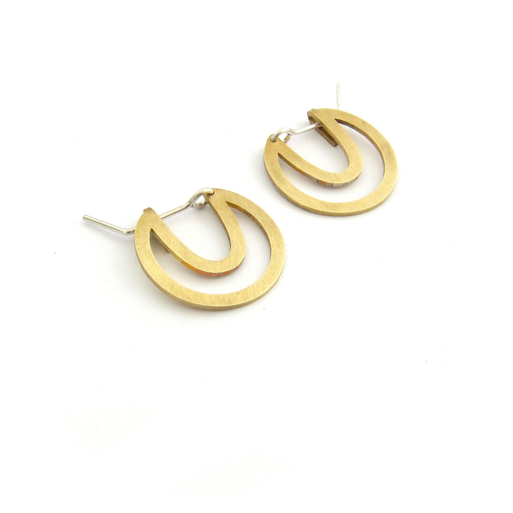 Designer disk earring, cutout in brass by Savage Jewellery made in Durban, South Africa