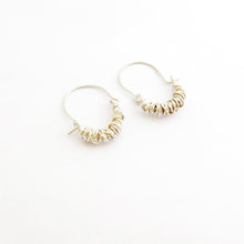 Wrapped wire hoop style earrings by designer Savage Jewellery