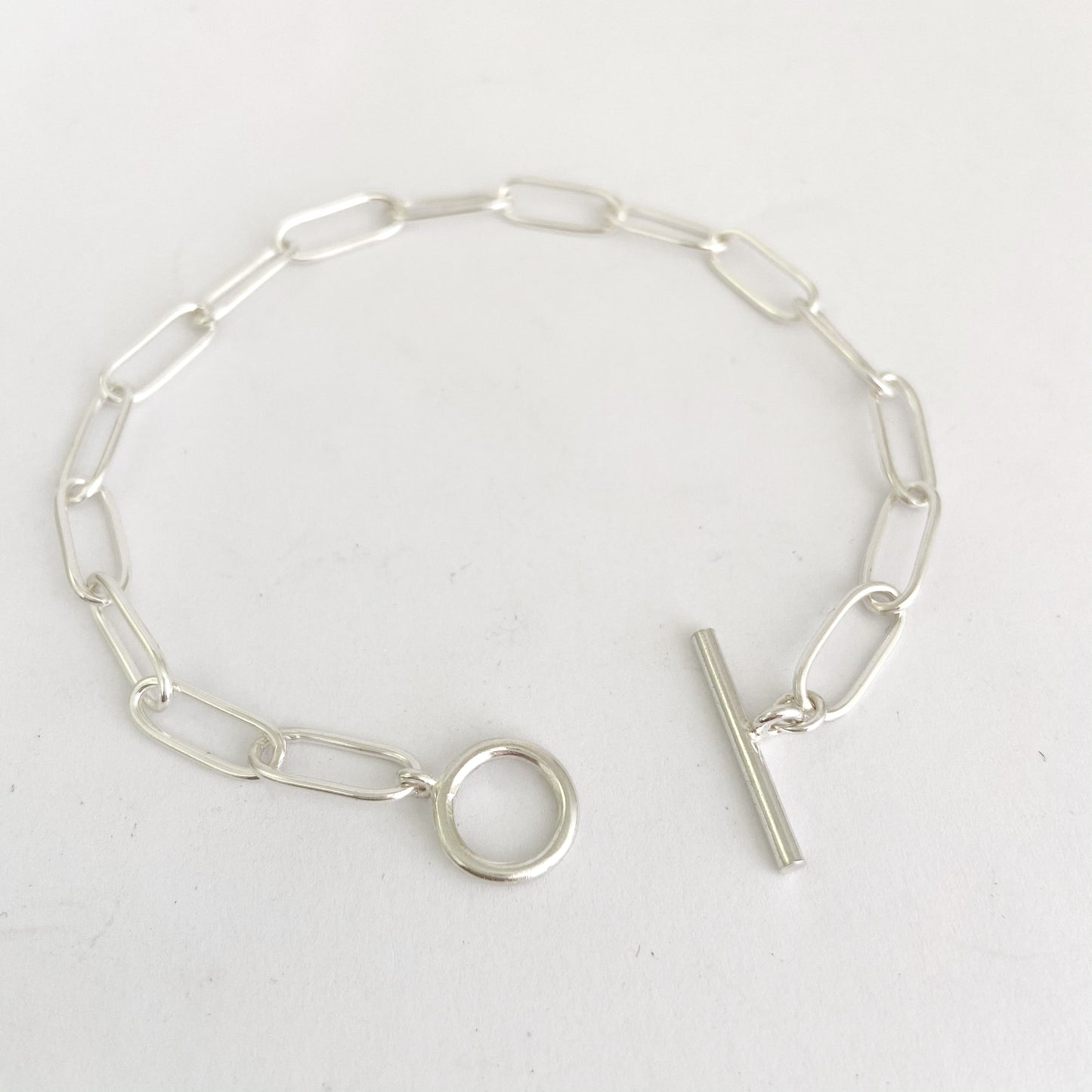 Simple paperclip chain bracelet with fob catch in sterling silver by Savage Jewellery